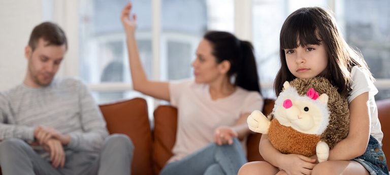 Parents fighting over joint vs. shared custody with child nearby