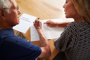 A man and a woman go over the details of Louisiana inheritance laws.