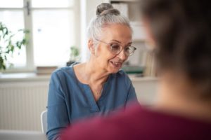 A smiling elderly woman discussing out of state wills valid in Louisiana.