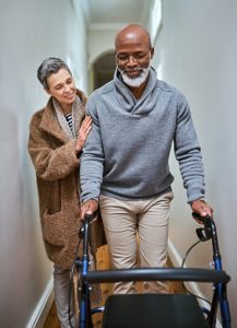 a man with a walker in a house going to discuss special needs estate planning with an attorney